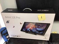 Front of factory box showing “Artist 22E Pro" branding and butterfly graphics.