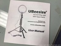 Front cover of UBeesize 10.2 inch ring light user manual showing ring light and tripod stand