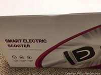 Box of the smart electric scooter showing product name and partial specs