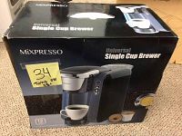 Front view of the Mixpresso Universal Single Cup Brewer box showing image of the coffee maker and product name.