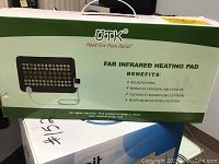 Box front showing UTK brand and benefits including pain relief, stress reduction, enhanced blood circulation, and muscular relaxation.