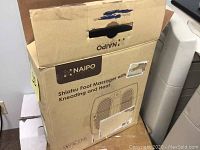 Closed Naipo Shiatsu Foot Massager box showing brand, product name, and function details.