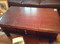 Top and side view showing three-panel top with scratches and side drawers