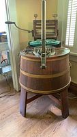 Overall view of washing machine showing wooden barrel and wringer mechanism