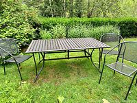 Full set of table and chairs on lawn