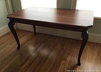 Full view of table showing top, legs and overall design