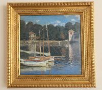 Front view of the framed print showing the river scene with sailboats and a stone bridge.