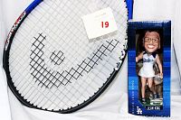 Photo showing Head Conquest tennis racket strings and part of the frame, along with Billie Jean King bobble head inside original Dodgers-themed box.