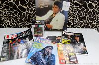 Lot of Michael Jackson memorabilia including the 'Thriller' vinyl album, Weenicon figurine in box, multiple magazines including LIFE, PEOPLE Weekly and JET, and a small promotional mini poster for 'Bad' CD.