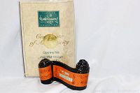 Photo of the Certificate of Authenticity showing the Walt Disney Classics Collection logo and the Pinocchio sculpture figurine.