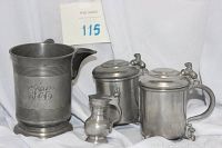 Four antique pewter items including three lidded tankards and one pitcher, all displayed on white fabric with lot number visible