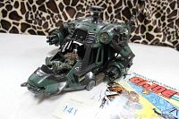 Hasbro G.I. Joe Night Attack Chopper toy with seated pilot figure next to 1983 G.I. Joe comic book in bag.