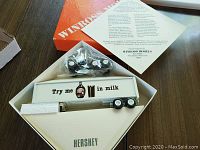Top view of Hershey Winross trailer truck in original box with removable trailer showing 'Try me in milk' graphic