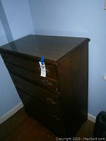 Full view of the Bassett wood chest of drawers, showing overall design and finish.