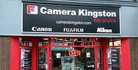 Storefront sign for Camera Kingston showing logos of Canon, FujiFilm, and Nikon