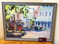 Framed print leaning against a wall, showing front view of artwork and frame.