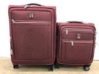 Front view of two burgundy Travelpro suitcases side by side