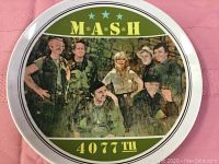 Front of the plate showing the M*A*S*H cast image, 4077th designation, and show title