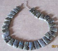 Full view of the necklace showing trapezoid labradorite beads and pearl accents with sterling silver clasp.