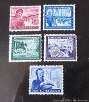 All five WWII German stamps shown in a single display. Various colors and designs featuring military and civilian images.