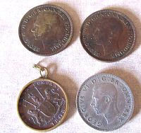 Top view showing obverse sides of the 1939 and 1945 George VI one penny coins and the 1808 East India Company coin in pendant setting, plus the 1948 two shillings coin.