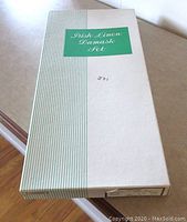 Original vintage box for Irish Linen Damask Set, rectangular with striped green and white design.