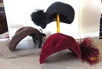 Three vintage 1940s hats arranged for display, showing details and condition.