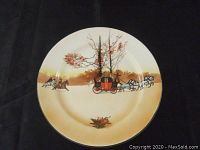 Full view of the vintage Royal Doulton collectible plate showing the Royal Mail Coach with horses and robbers in a countryside scene.