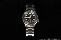 Front view of watch face on black background showing bezel and dial