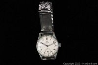 Full front view of wristwatch on black background