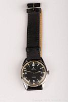 Full view of the Sandoz wristwatch showing black leather strap and stainless steel case.