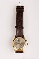 Front view of watch showing dial, case and strap