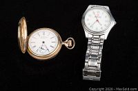 Both watches shown side by side against a black background. Waltham pocket watch with cover open and Wenger wristwatch with metal bracelet clearly visible.