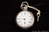 Front view of antique Providence Watch Co. silver pocket watch with white face, Roman numerals, and black hands. Attached winding key tied with cord.