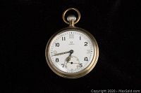 Front view of enamel dial showing Arabic numerals and sub-seconds.