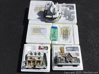 Three Hawthorne Village buildings in original styrofoam packaging showing two buildings with cords and boxes on pavement.