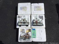 Three Thomas Kinkade Hawthorne Village buildings in original Styrofoam packaging: two larger buildings with electric cords and one smaller building with Christmas decorations and snow accents.