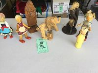 Overview of all wooden dolls and carved figures showing the variety and style