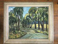 Frontal view of full painting and frame showing tree-lined road landscape