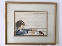 Photo of the entire framed watercolor painting showing the child reaching towards the butterfly with the horizontal lined background and natural wood frame.
