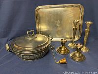 Full set of vintage silver pieces including serving bowl with lid and enamel insert, serving tray with engraved monogram, and four candle holders of two different heights.