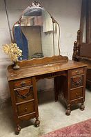 Front view of vanity showing drawer configuration and mirror