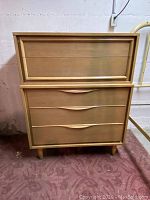 Front view of full dresser showing five drawers and light wood finish.