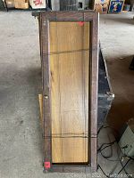 Two vintage wooden framed glass doors measuring about 30 inches by 11 inches each, with clear glass panels. Doors tied with wire for handling.