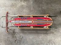 Top-down view of the entire sled showing the vintage painted design and metal runners.