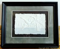 Framed cast paper sculpture art of flying geese, showing full artwork and frame.