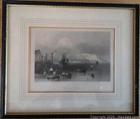 Framed vintage engraved artwork depicting a waterfront scene with boats and a distant citadel, visible mat borders and signature beneath image.