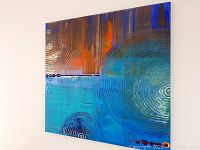 Angled full view of painting hung on wall