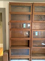 Full view of two columns of stackable barrister bookcase units showing overall height and number of sections