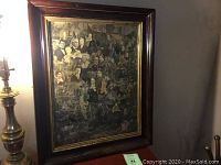 Full framed artwork showing the collage of vintage portraits in an antique frame.